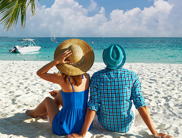 couple-in-blue-clothes-on-a-beach-at-maldives.jpg